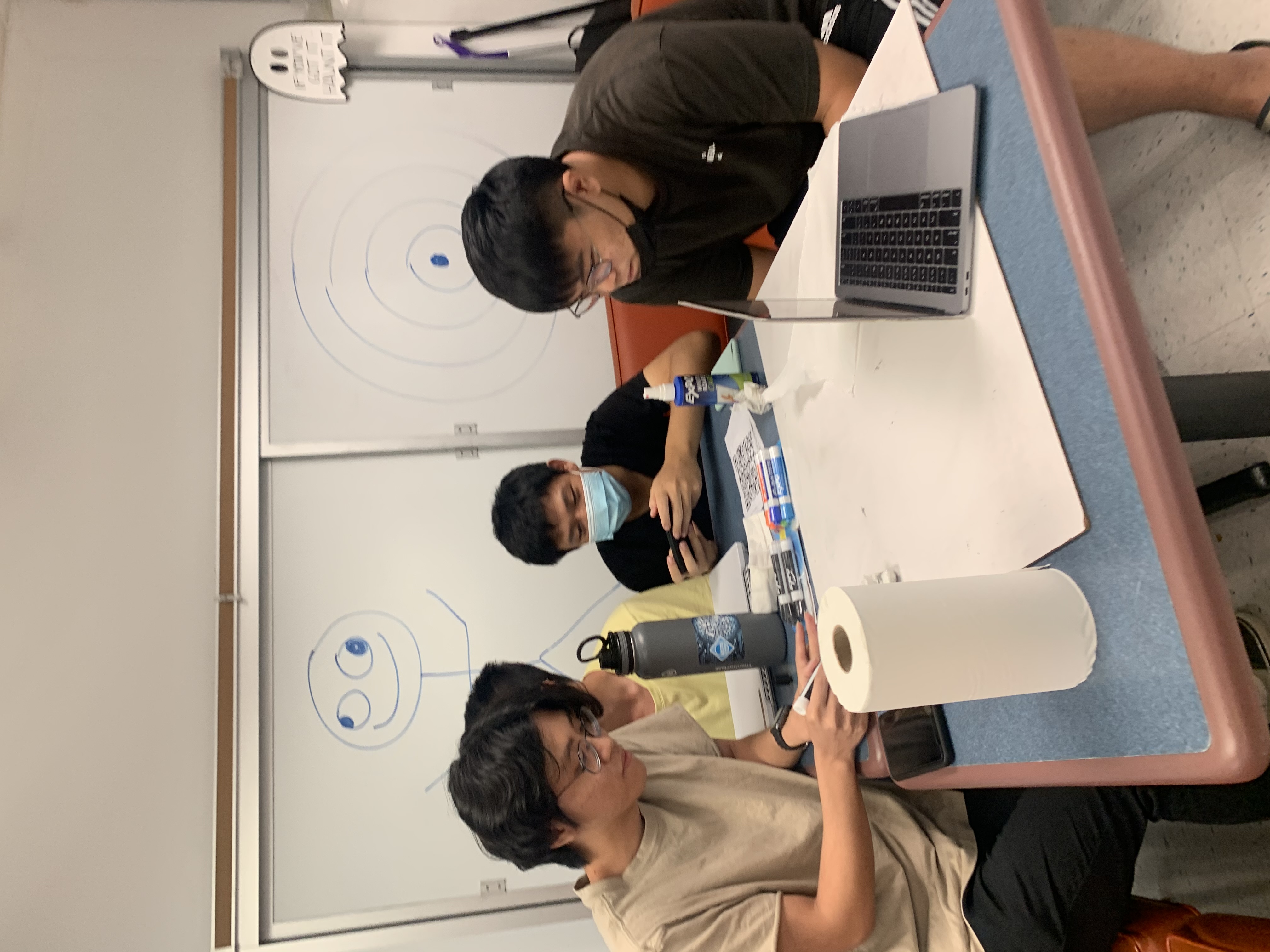 A group of 4 students working on something together